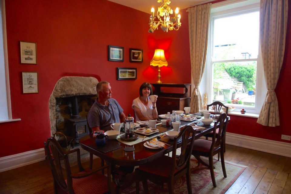 Two people sitting down at tabl to enjoy mean along the trail, Coast to Coast Path, UK