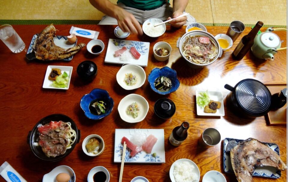 A table covered in small portions of delicious traditional Japanese food. Typical of the meals you get on the Kumano Kodo.