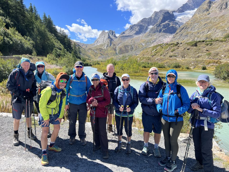 Large group of hikers ready to embark on Tour du Mont Blanc.