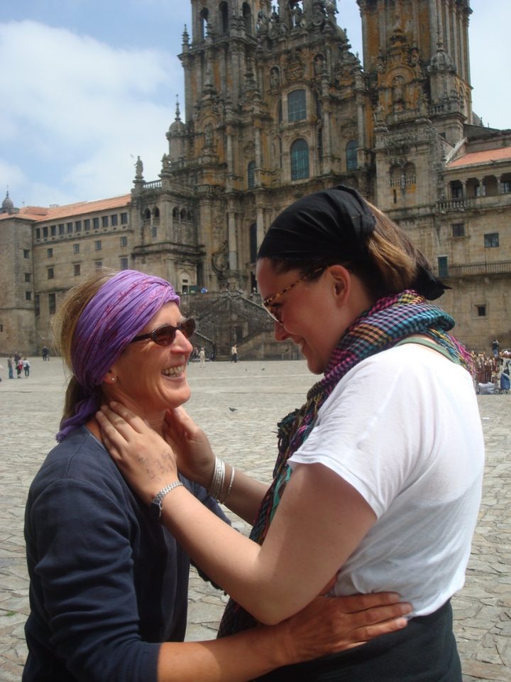 Two women looking towards each other smiling in Santiago