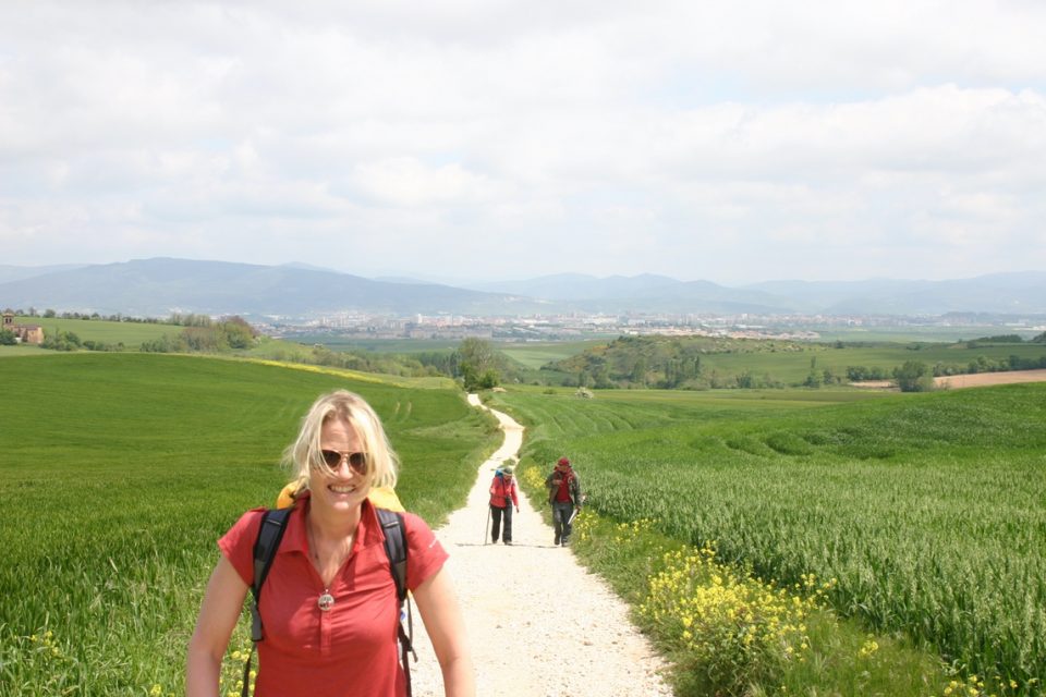 Woman making her way along the Camino Francés trail.