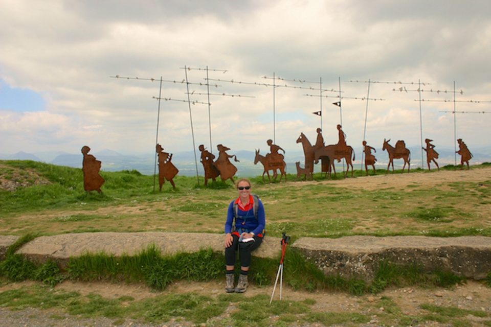 sitting in front of the Camino art installation along the Camino