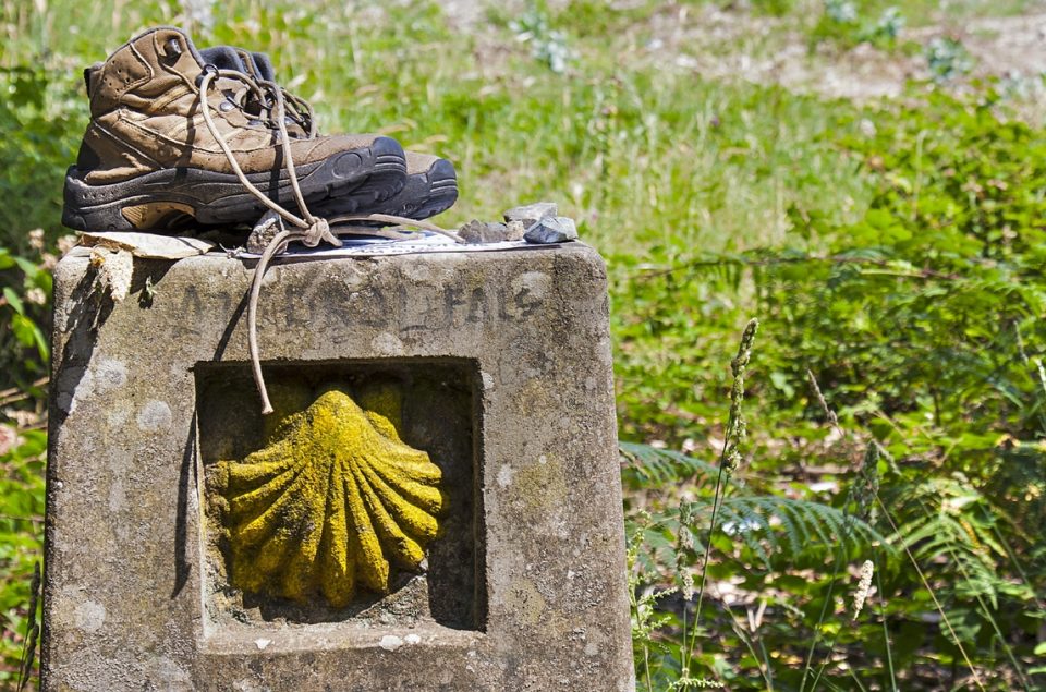 Boots on a landmark of Camino de Santiago