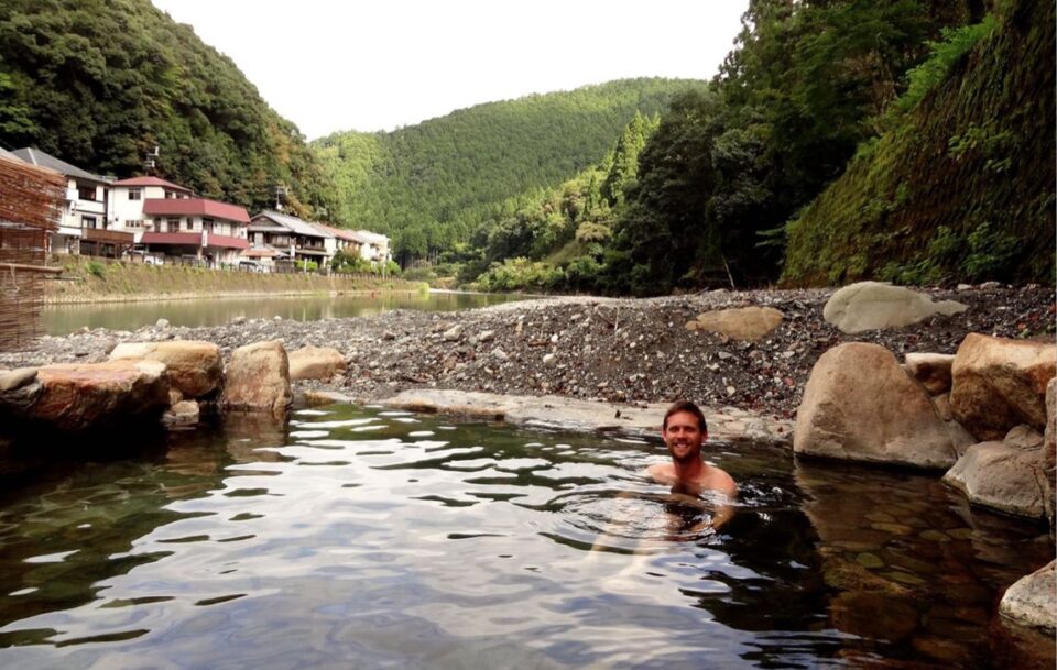 man sitting in onsen in Japan