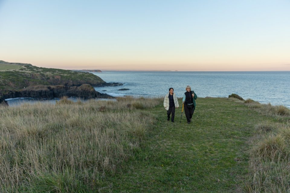 walkers along a green field Mornington Peninsula