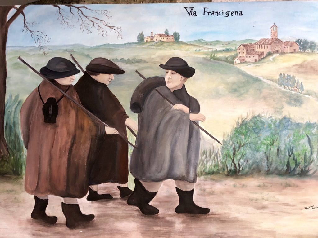 Medieval pilgrims walking the Via Francigena