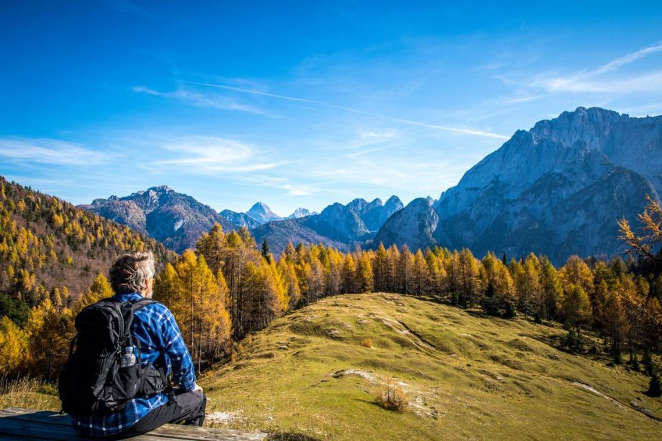 Senior man looking at beautiful autumn, Julian Alps