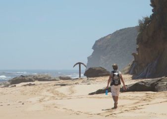 Walk Cover Image GOW Walker on beach with giant anchor sticking up out of the sand.