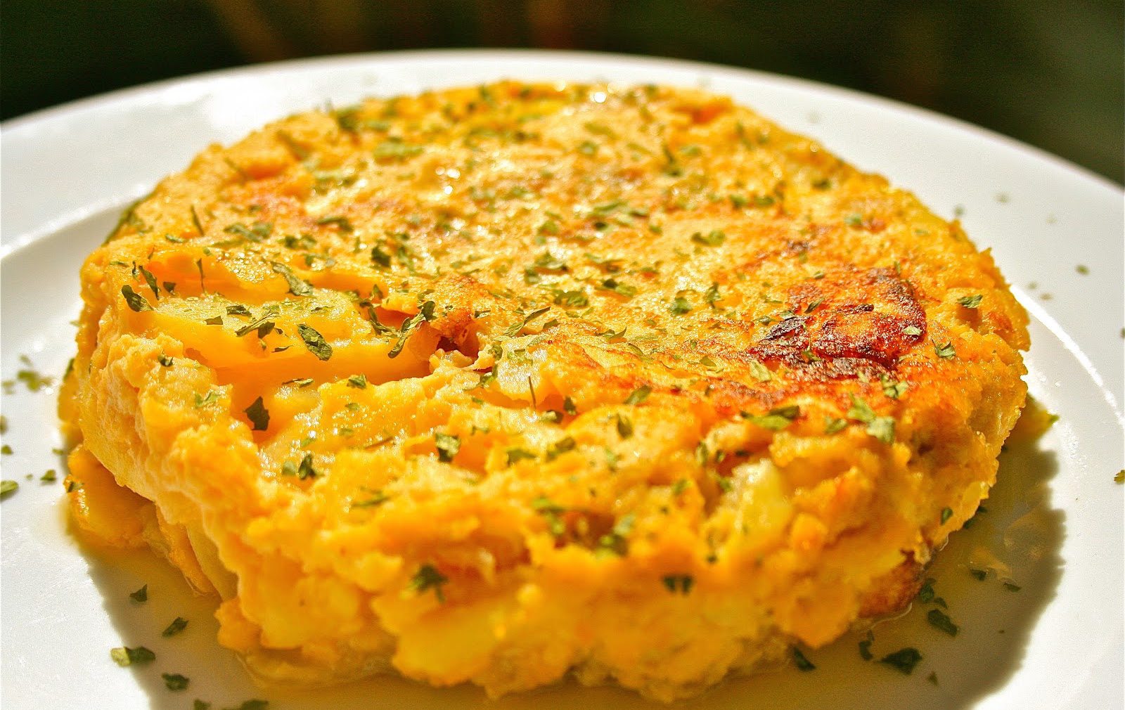 Spanish Omelette, Camino de Santiago Closeup of a fluffy yellow Tortilla Espaniola - a Spanish omelette made with eggs, potatoes and onions.