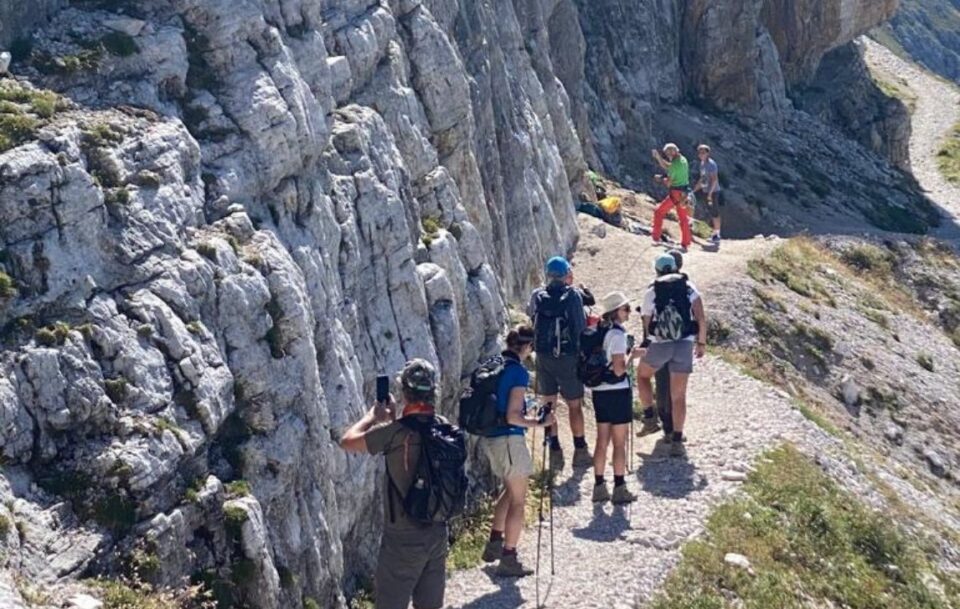close up of group on path to Rifugio Averau