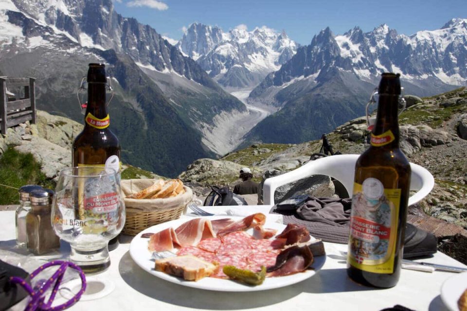 A plate of food with mountains in the background.
