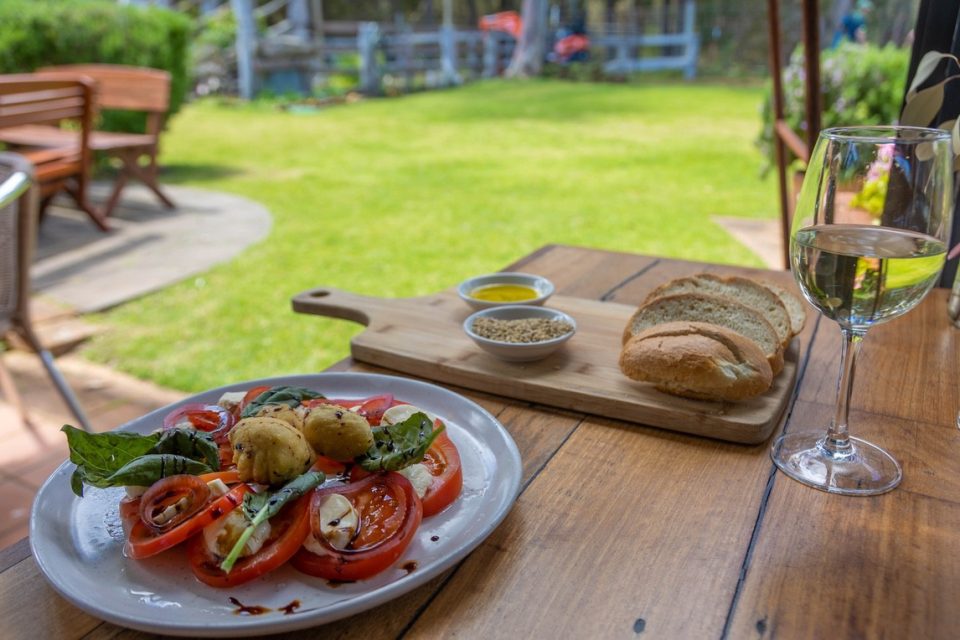 Enticing platters of fresh bread and sliced tomatoes