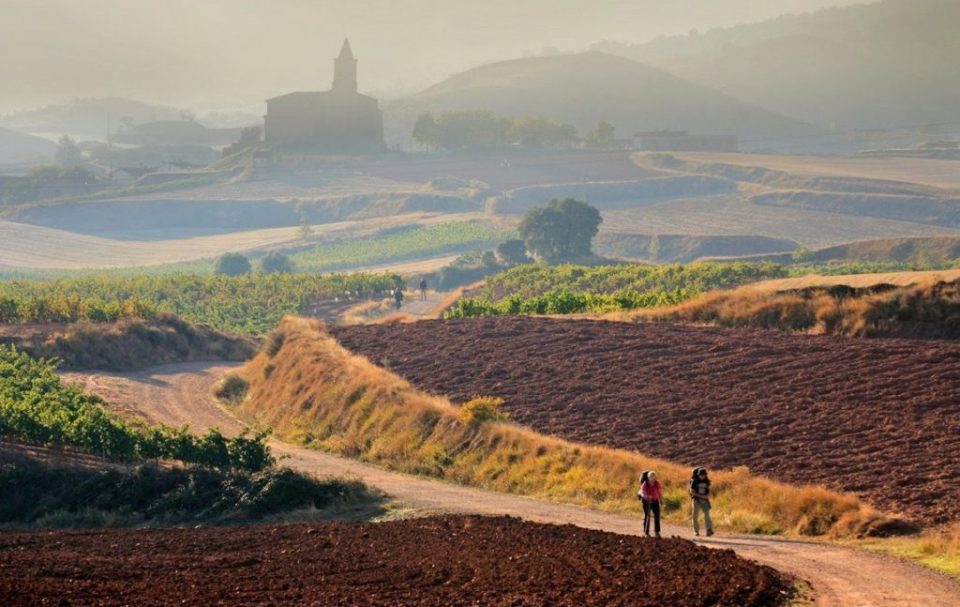 The Camino de Santiago trail in Spain with two hikers