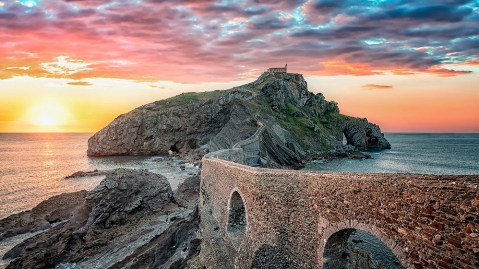 San Juan De Gaztelugatxe Camino del Norte Sun setting behind the bridge to the island of San Juan De Gaztelugatxe on Spain's Basque coast.