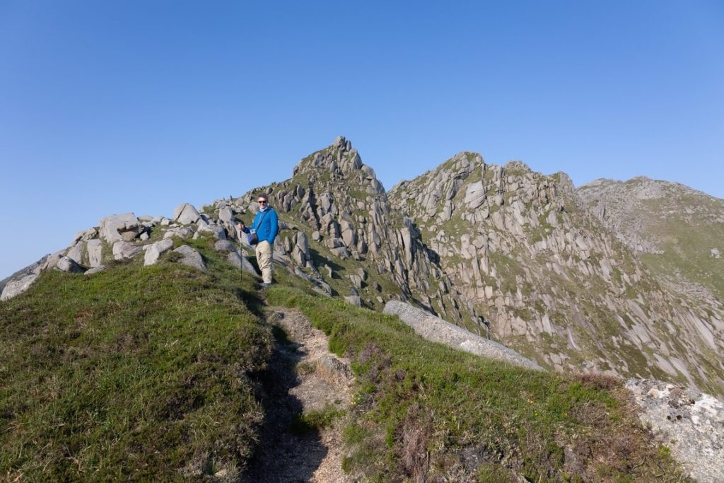 Hiker on mountain on Arran Coastal Way