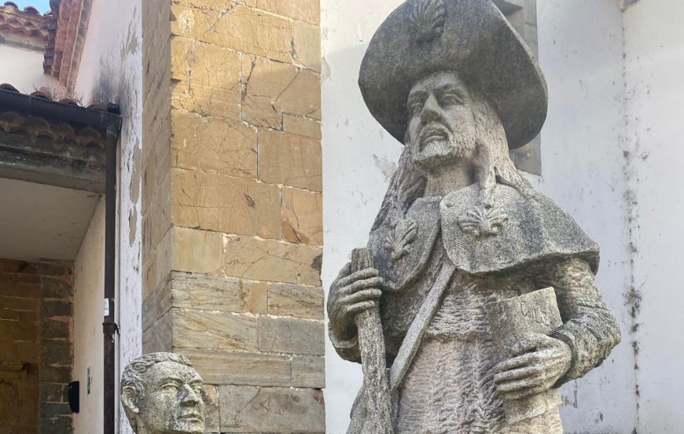 Close up of a grey stone statue in a street in Northern Spain