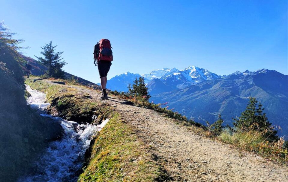 Hiker on the trail Haute Route Switzerland