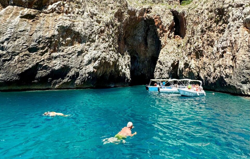 Swimmer along coastline Puglia
