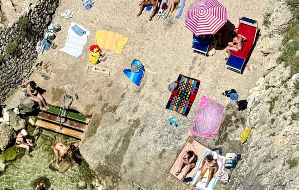 sunbakers on Puglia coastline