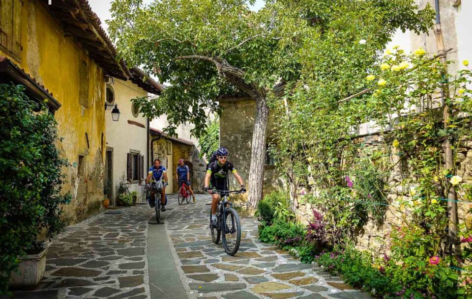 Cyclist on a cobble stone path in Slovenia