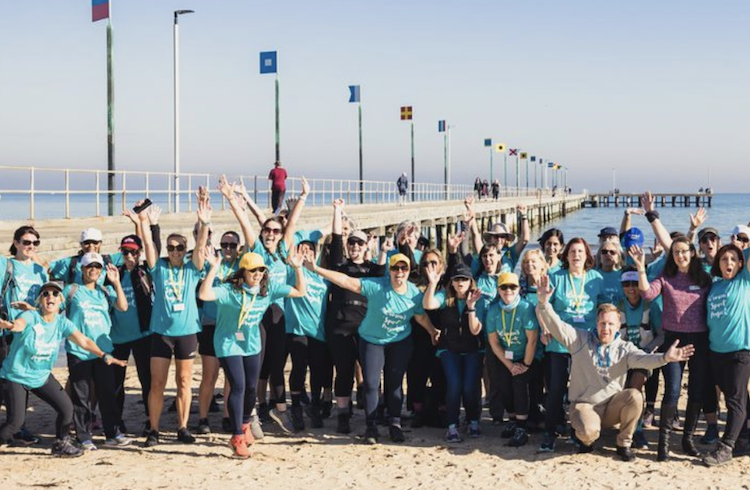 WSP group Women's Spirit Project group gathered in front of a pier about to embark on walk