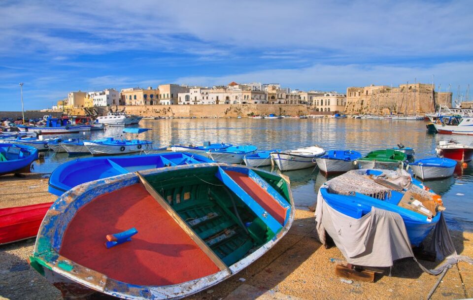 colourful rowing boats and fishing boats in the harbour