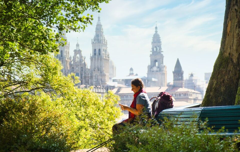 Female hiker resting near Santiago de Compostela on the Camino Frances