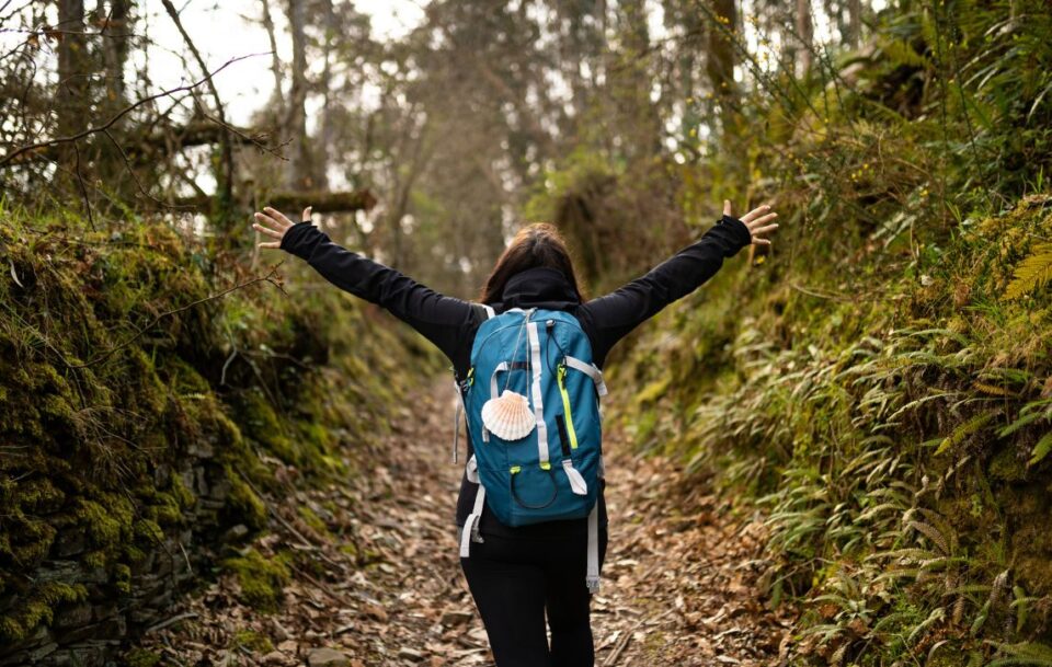 Female hiker resting near Santiago de Compostela on the Camino Frances