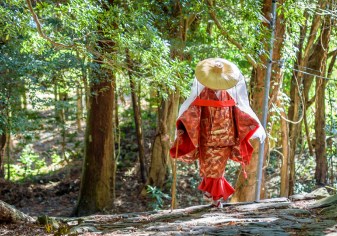 Japanese woman wearing traditional Heian Period costume on the Kumano Kodo Pilgrimage Route in the Wakayama prefecture of Japan