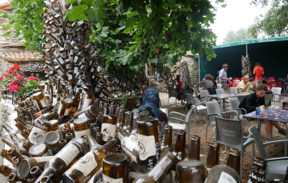A tower of empty wine bottles to make a sculpture.
