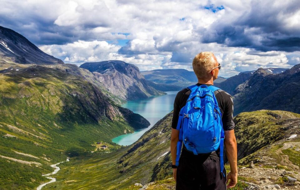 Hiker looking out onto the fjords, Norway.