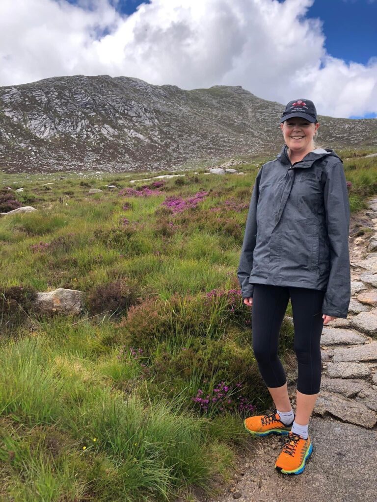 Female hiker on a stone path on the Isle of Arran in Scotland