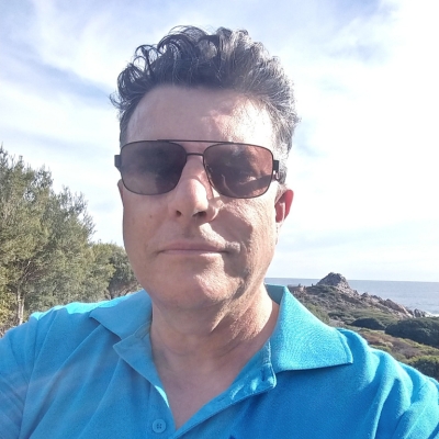 Head and shoulders portrait of Arnold Greyling, RAW Travel's driver for the Cape to Cape Track in Western Australia.