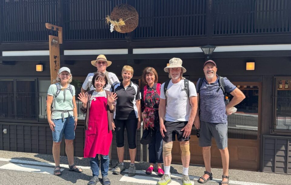 Japanese host with group hikers Nakasendo Way