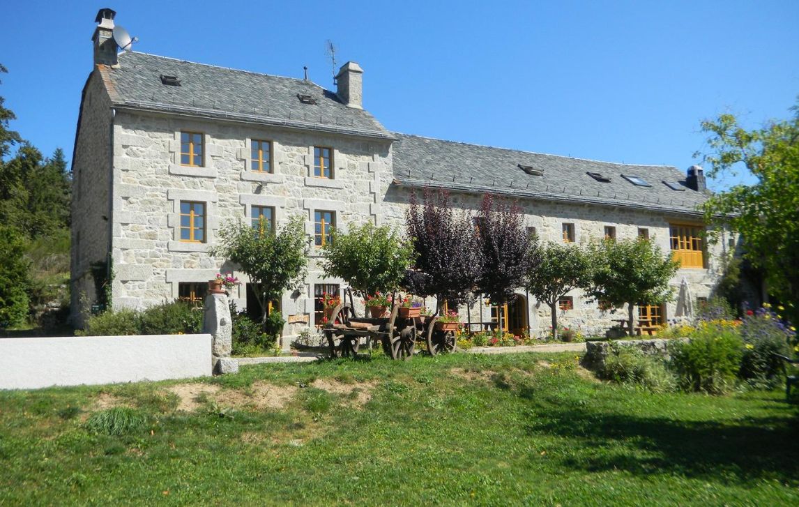 Hotel L'Oustal de Parent, France Exterior of a charming stone farmhouse hotel on Le Puy Camino in France.