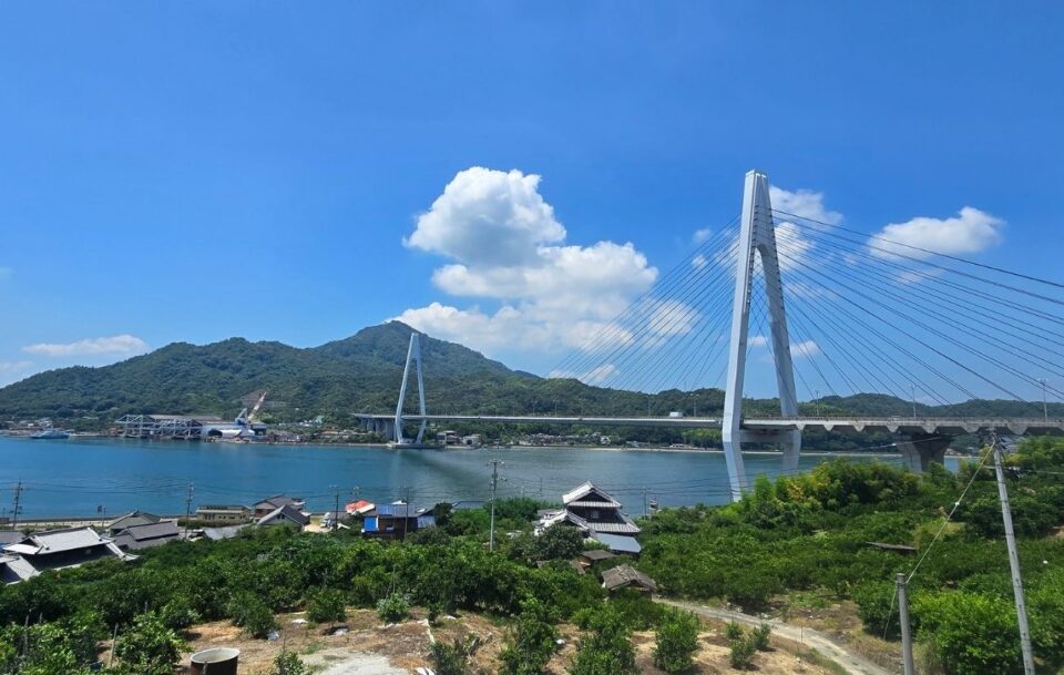 Tatara Bridge over the Shimanami Kaido under a clear blue sky.