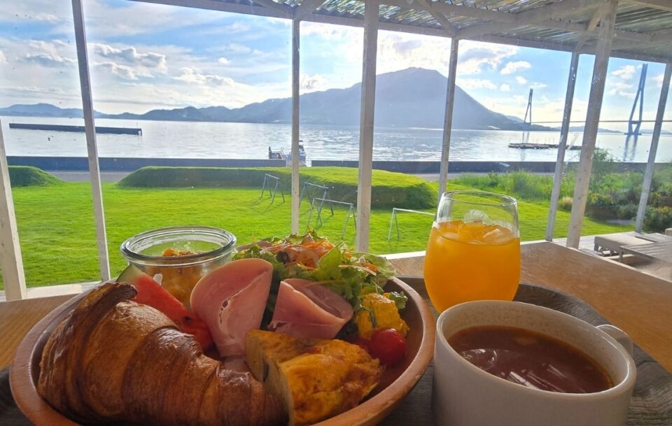 Meal served on a table overlooking the sea and mountains, Shimanami Kaido