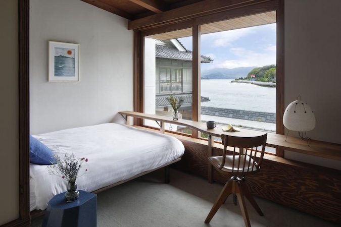 Interior of a hotel with scenic views of Sedota along the Shimanami Kaido cycling route, Japan.