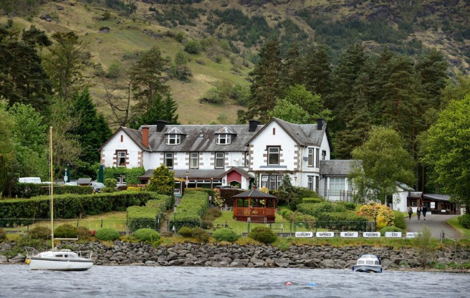 White exterior of Ardlui Hotel on the banks of Loch Lomond, West Highland Way, Scotland.