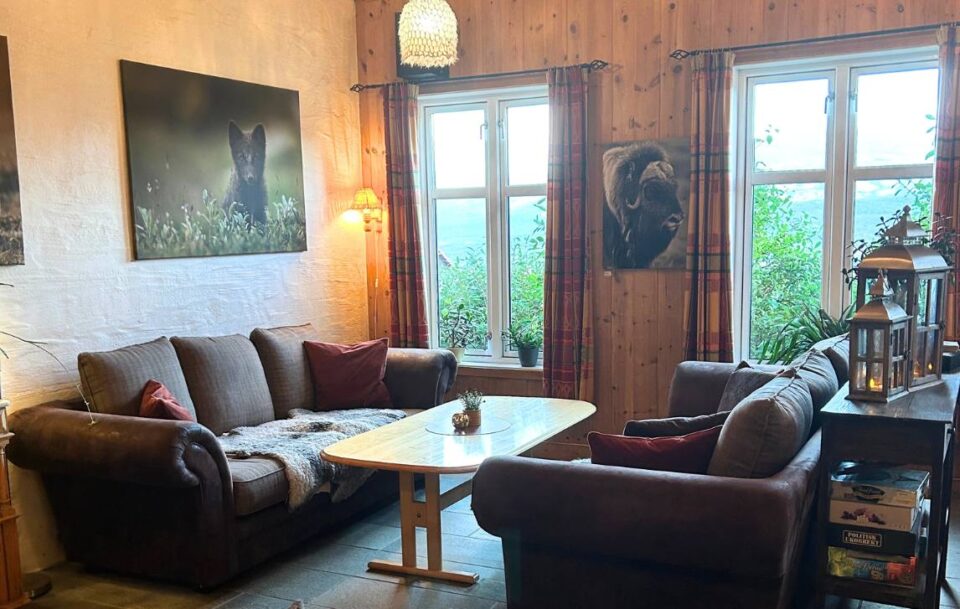 Warm guesthouse lounge room featuring retro décor, St Olav's Way.