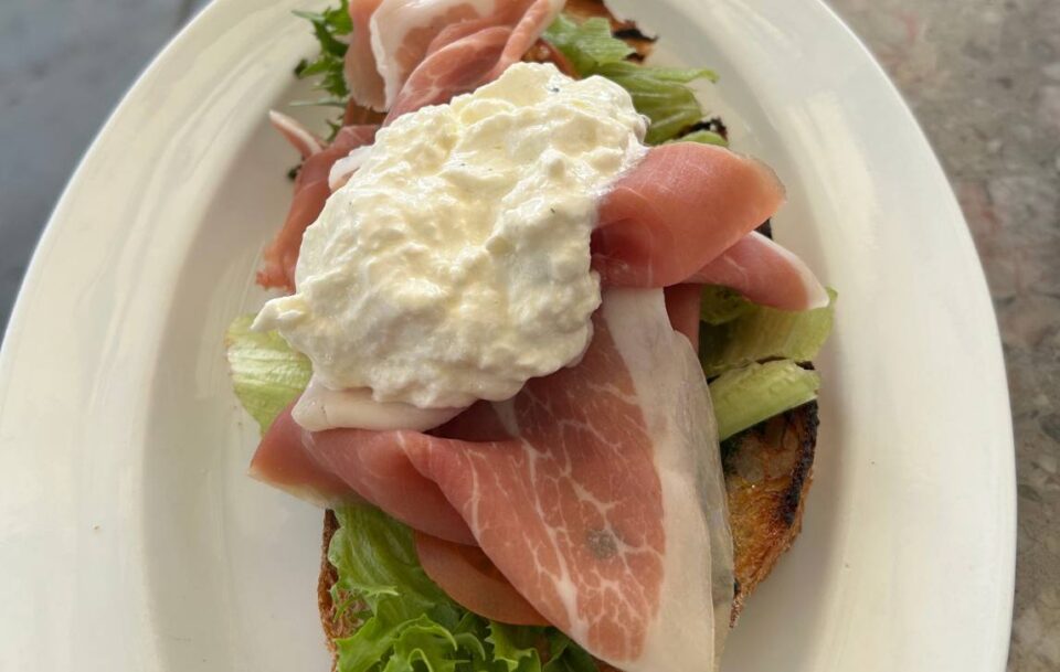 Close-up of a toast with prosciutto, cottage cheese and lettuce, St Olav's Way, Norway.