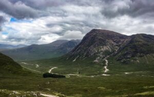 View of craggy, treeless mountains in the Scottish Highlands.