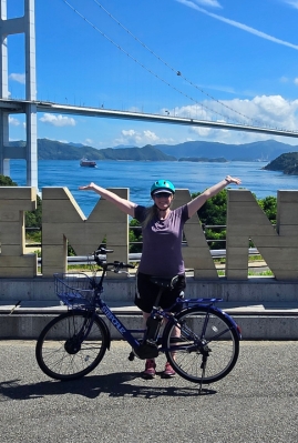 Happy cyclist on Japan's Shimanami Kaido cycling route