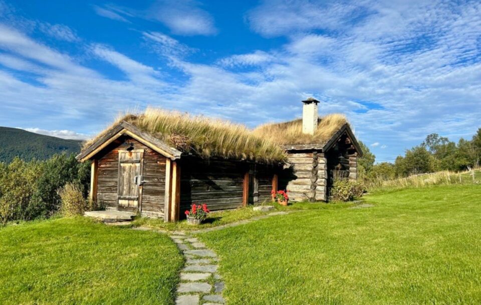 Traditional rustic Norwegian turf hut in a mountain pasture on St Olav's Way.