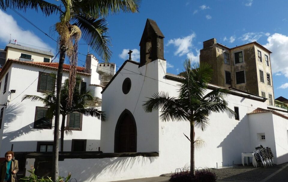Striking exterior of a white church in the town of Funchal in Madeira.