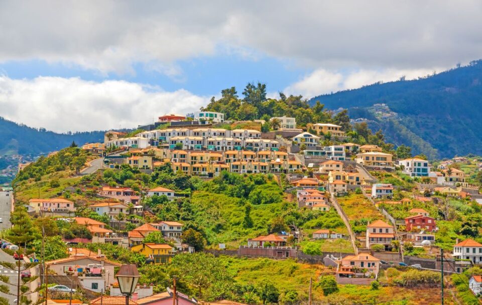Panoramic view of Funchal, Madeira, showing its hillside covered with orange-roofed houses