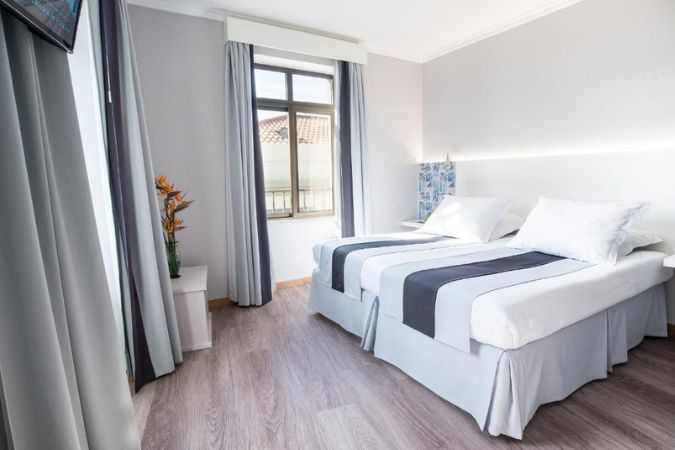 Interior of a modern, white hotel room on Madeira Island, Portugal
