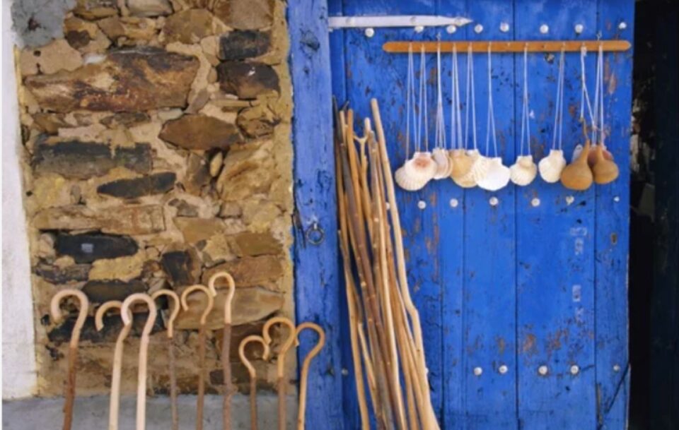 Blue door with Camino shells